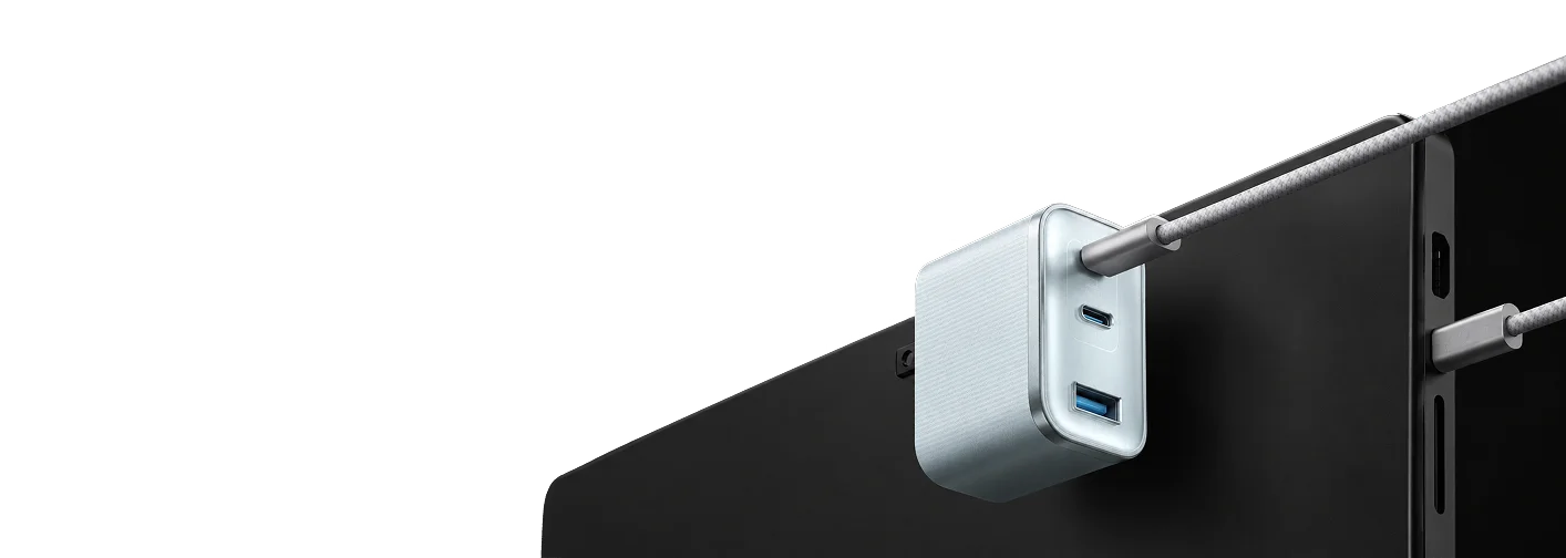 Dual-port USB-C fast GaN charger with braided high-speed cable connected to modern device